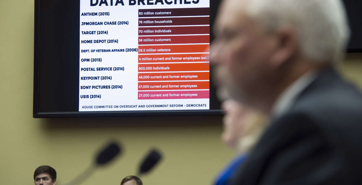 A chart of data breaches is shown on Capitol Hill in Washington, Tuesday, June 16, 2015, as witnesses testify before the House Oversight and Government Reform committee's hearing on the Office of Personnel Management (OPM) data breach. (AP Photo/Cliff Owen)