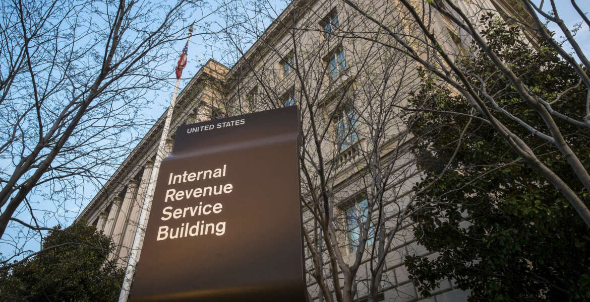 FILE - In this April 13, 2014 file photo, the Internal Revenue Service Headquarters (IRS) building is seen in Washington. The IRS says thieves used an agency website to steal tax information from as many as 220,000 additional taxpayers. The agency first disclosed the breach in May. Monday’s revelation more than doubles the total number of potential victims, to 334,000.  (AP Photo/J. David Ake, File)