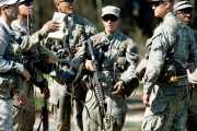 In this photo taken on Aug. 4, 2015, a female Army Ranger stands with her unit during Ranger School at Camp Rudder on Eglin Air Force Base, Fla. According to the Northwest Florida Daily News, she and one other female were the first to complete Ranger training and earn their Ranger tab this week. (Nick Tomecek/Northwest Florida Daily News via AP) MANDATORY CREDIT