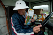 Danny Joe delivers mail as it rains in San Bruno Calif., on Thursday, Dec. 11, 2014. Joe has worked for the United States Postal Service for twenty years and said this was the worst storm he's ever worked through. (AP Photo/Alex Washburn)