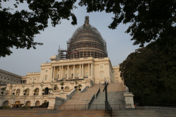 The west front of the U.S. Capitol is seen under repair Sept. 2, 2015 in Washington. Congress returns on Sept. 8 with a critical need for a characteristic that has been rare through a contentious spring and summer _ cooperation between Republicans and President Barack Obama. Lawmakers face a weighty list of unfinished business and looming deadlines, with a stopgap spending bill to keep the government open on Oct. 1 paramount. (AP Photo/Alex Brandon)