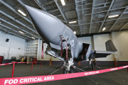 An F-35C Lightning II test aircraft is on static display in the hanger deck of the nuclear powered aircraft carrier USS Dwight D. Eisenhower of the coast of Norfolk, Va., Friday, Oct. 9, 2015. The aircraft was doing test landings and launches from the ship.  The aircraft is expected to be deployed in 2018 with the Navy.  (AP Photo/Steve Helber)