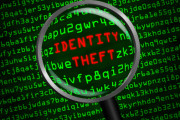 Identity Theft revealed in computer code through magnifying glass