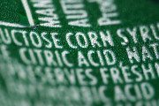 FILE - This Sept. 15, 2011 file photo shows a nutrition label that lists high fructose corn syrup as an ingredient in a can of soda, in Philadelphia. In a trial starting Tuesday, Nov. 3, 2015, jurors in the case between sugar processors and corn manufacturers will take up one of nutrition’s most vexing debates and confront a choice common among some consumers: sugar or high fructose corn syrup? (AP Photo/Matt Rourke, File)