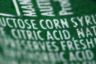 FILE - This Sept. 15, 2011 file photo shows a nutrition label that lists high fructose corn syrup as an ingredient in a can of soda, in Philadelphia. In a trial starting Tuesday, Nov. 3, 2015, jurors in the case between sugar processors and corn manufacturers will take up one of nutrition’s most vexing debates and confront a choice common among some consumers: sugar or high fructose corn syrup? (AP Photo/Matt Rourke, File)