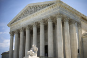 In this photo taken June 30, 2014, the Supreme Court building is seen in Washington. The Supreme Court seems divided over whether Internet search sites can be sued for publishing false information about people if the errors don't cause any real harm. The justices appeared to split along ideological lines Monday during arguments in a case that pits business groups concerned about exposure to costly litigation against consumer protection advocates who want companies held accountable for mistakes. (AP Photo/Pablo Martinez Monsivais)