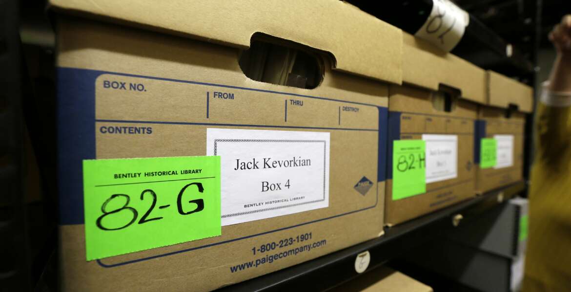 In a photo from Thursday, Oct. 22, 2015, in Ann Arbor, Mich., boxes containing files on assisted suicide that belonged to Dr. Jack Kevorkian are stored at the Bentley Historical Library. The archive was donated by Ava Janus, Kevorkian's niece and sole heir. (AP Photo/Carlos Osorio)