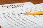 Standardized test with pencil and report card