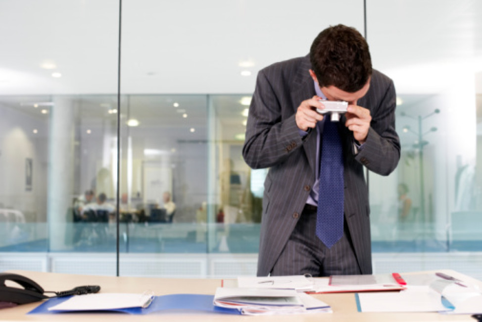 Businessman Photographing Documents