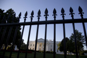 FILE - In this Sept. 22, 2014, file photo, the White House is photographed from Pennsylvania Avenue in Washington. Americans want to know the names of donors who are giving to all groups that work to elect candidates _ and by an overwhelming majority believe that requiring disclosure would be an effective way to reduce the influence of money in politics. The views on disclosure cut across party lines, with 78 percent of Democrats and 78 percent of Republicans favoring a disclosure requirement, according to an Associated Press-NORC Center for Public Affairs Research poll released the week of Dec. 7, 2015. (AP Photo/Carolyn Kaster, File)