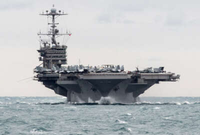 In this Saturday, Dec. 26, 2015 photo released by the U.S. Navy, the aircraft carrier USS Harry S. Truman transits the Strait of Hormuz. Iranian naval vessels conducted rocket tests last week near the USS Harry S. Truman aircraft carrier, the USS Bulkeley destroyer and a French frigate, the FS Provence, and commercial traffic passing through the Strait of Hormuz, the American military said Wednesday, Dec. 30, 2015 causing new tension between the two nations after a landmark nuclear deal. (Mass Communication Specialist 2nd Class M. J. Lieberknecht/U.S. Navy via AP) MANDATORY CREDIT