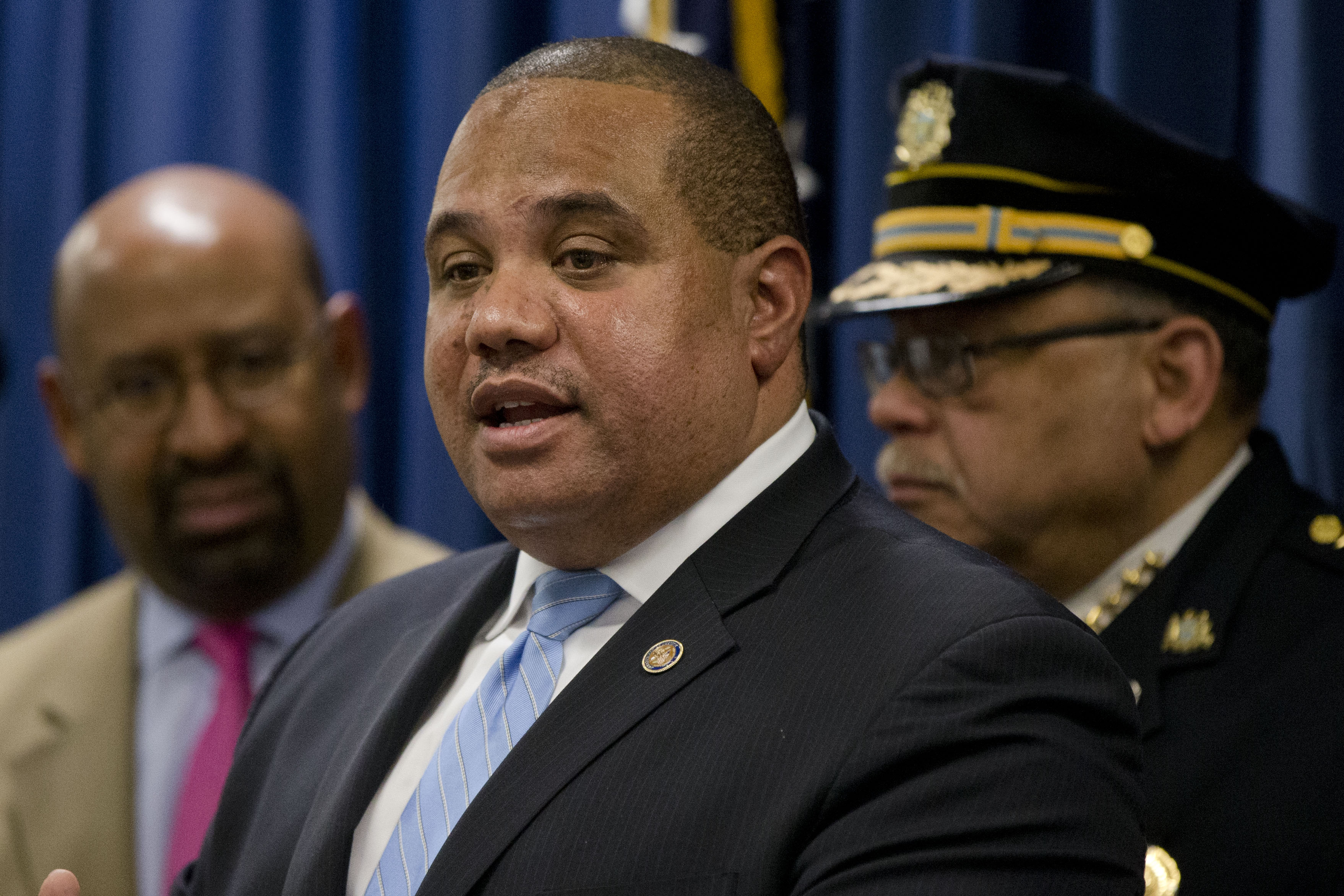Philadelphia Police Commissioner Charles Ramsey, right, and Mayor Michael Nutter, left, listen to Department of Justice’s Ronald Davis, director of the Office of Community Oriented Policing Services (COPS) speak during a news conference Tuesday, Dec. 22, 2015, in Philadelphia. Justice Department officials are praising the Philadelphia Police Department for its progress in implementing reforms after a federal probe on deadly force. The report issued in May found the department's use of deadly force was motivated by fear and affected mostly black citizens. (AP Photo/Matt Rourke)