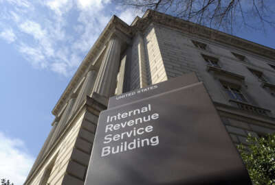 FILE - In this March 22, 2013 file photo, the exterior of the Internal Revenue Service (IRS) building in Washington. Got a question for the IRS on your taxes? Online may end up being the only answer. The IRS may soon dramatically scale back telephone and face-to-face service as part of a future plan that would focus more on online accounts for the 150 million individual taxpayers and 11 million businesses seeking help and information, the agency’s official watchdog warned. (AP Photo/Susan Walsh, File)