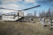 New York Army National Guard Soldiers from C Troop 2nd Squadron 101st Cavalry, from Buffalo, simulate being inserted at a landing zone from a U.S. Army CH-47 Chinook helicopter assigned to Company B, 3rd Battalion , 126th Aviation at the Youngstown Local Training Area in Youngstown, N.Y., Feb. 20, 2016. The Soldiers are training in preparation for larger scale exercises to be held throughout the year. (U.S. Air National Guard photo by Staff Sgt. Ryan Campbell/Released)