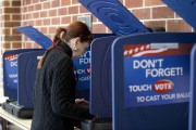 A woman casts her ballot in the South Carolina Republican Presidential Primary Saturday, Feb. 20, 2016, in Columbia, S.C. (AP Photo/John Bazemore)