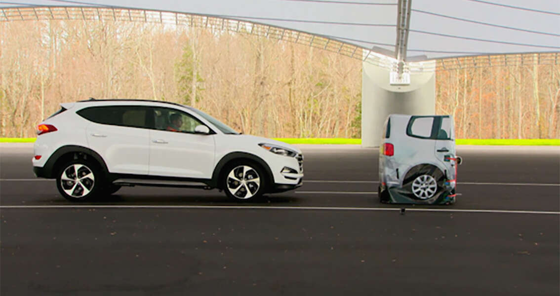 In this frame grab from video provided by the  Insurance Institute for Highway Safety (IIHS), taken in 2015, a vehicle closes in on a Strikeable Surrogate Vehicle (SSV) at the IIHS Vehicle Research Center in Ruckersville, Va. Federal regulators and the auto industry are taking a more lenient approach than safety advocates would like to phasing in automatic braking systems for passenger cars, according to the official records of their closed-door negotiations. Systems that automatically apply brakes to prevent or mitigate collisions, rather than waiting for the driver to act, are the most important safety technology available today that’s not already required in cars. (Insurance Institute for Highway Safety via AP)