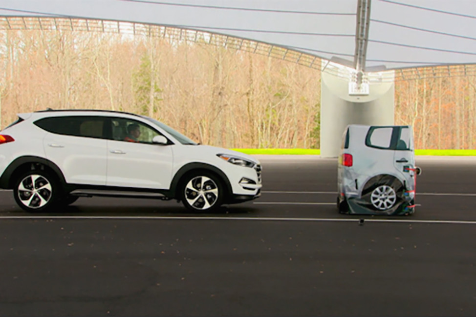 In this frame grab from video provided by the  Insurance Institute for Highway Safety (IIHS), taken in 2015, a vehicle closes in on a Strikeable Surrogate Vehicle (SSV) at the IIHS Vehicle Research Center in Ruckersville, Va. Federal regulators and the auto industry are taking a more lenient approach than safety advocates would like to phasing in automatic braking systems for passenger cars, according to the official records of their closed-door negotiations. Systems that automatically apply brakes to prevent or mitigate collisions, rather than waiting for the driver to act, are the most important safety technology available today that’s not already required in cars. (Insurance Institute for Highway Safety via AP)