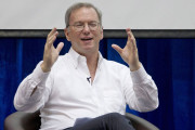 FILE - In this Friday, March 22, 2013, Google Executive Chairman Eric Schmidt gestures during  an interactive session with group of students at a technical university in Yangon, Myanmar .  Schmidt said the future is now for YouTube, which recently passed the milestone of 1 billion unique visitors every month. But, he added with the Third World in mind, if you think that's a large number, wait until you get to 6 (billion) or 7 billion. (AP Photo/Gemunu Amarasinghe, file)