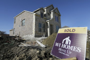 In this Tuesday, Feb. 2, 2016, photo, a sold sign sits next to a house under the final stages of construction in Plano, Texas. On Thursday, March 10, 2016, Freddie Mac reports on the week’s average U.S. mortgage rates. (AP Photo/LM Otero)