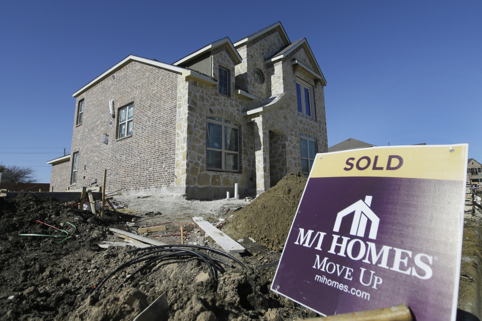 In this Tuesday, Feb. 2, 2016, photo, a sold sign sits next to a house under the final stages of construction in Plano, Texas. On Thursday, March 10, 2016, Freddie Mac reports on the week’s average U.S. mortgage rates. (AP Photo/LM Otero)