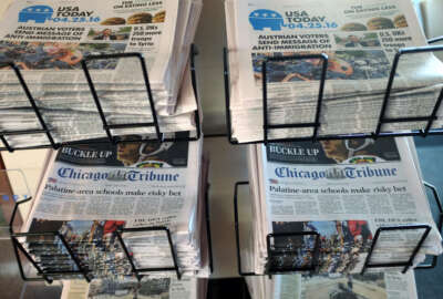FILE - In this Monday, April 25, 2016, file photo, USA Today, Chicago Tribune and other newspapers are displayed at Chicago's O'Hare International Airport. Gannett is escalating its pursuit of rival newspaper company Tribune, telling shareholders of Tribune not to vote for its board member nominees up for election in June. Gannett, the publisher of USA Today and other newspapers, said Monday, May 2, 2016, that withholding a vote at Tribune's annual meeting in June will send a message to the management team that it needs to engage in takeover talks.  (AP Photo/Kiichiro Sato, File)