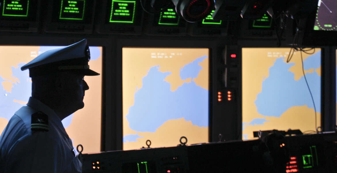 FILE- In this Tuesday, June 7, 2011 file photo, a US Navy officer, name not available, stands on the weapons control deck of the USS Monterey as screens display the Black Sea region, in the Black Sea port of Constanta, Romania. A U.S. missile defense system aimed at protecting Europe from ballistic missile threats is moving into higher gear this week, with a site in the village of Deveselu, Romania becoming operational on Thursday, May 12, 2016, and officials breaking ground at a separate site in Poland a day later.(AP Photo/Vadim Ghirda, File)