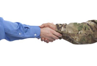 Military and Businessman Handshake