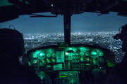 Capt. Jonathan Bonilla and 1st Lt. Vicente Vasquez, 459th Airlift Squadron UH-1N Huey pilots, fly over Tokyo after completing night training April 25, 2016. The 459th AS frequently trains on a multitude of scenarios in preparation for potential real-world contingencies and operations. (U.S. Air Force photo/Yasuo Osakabe)