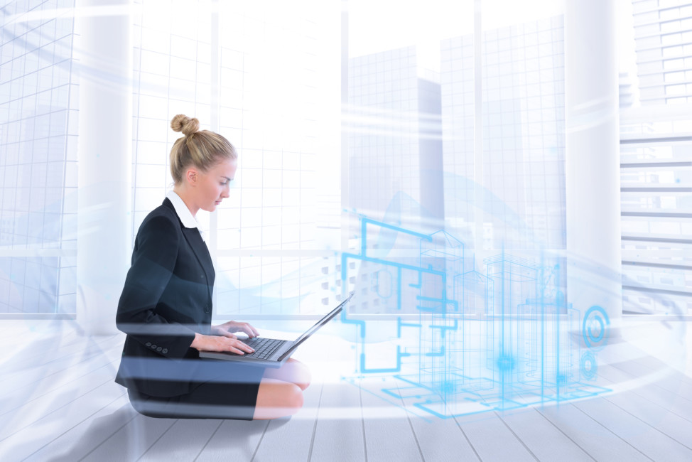 Composite image of businesswoman using laptop