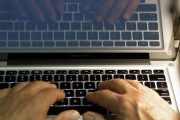 FILE - In this Feb. 27, 2013, file photo, hands type on a computer keyboard in Los Angeles. News that Facebook founder Mark Zuckerberg's rarely used Twitter, LinkedIn and Pinterest accounts were briefly compromised should serve as a reminder that we’re all susceptible to hacking. (AP Photo/Damian Dovarganes, File)