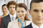 portrait of two businessmen and two businesswomen in a row