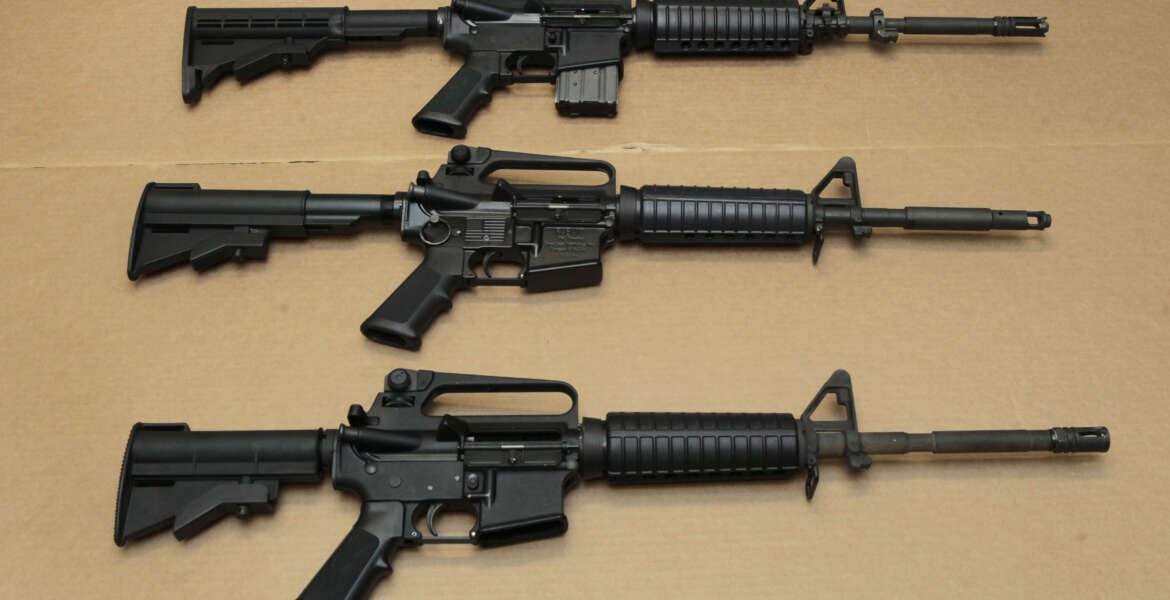 FILE -- In this Aug. 15, 2012 file photo, three variations of the AR-15 assault rifle are displayed at the California Department of Justice in Sacramento, Calif. While the guns look similar, the bottom version is illegal in California because of its quick reload capabilities. Omar Mateen used an AR-15 that he purchased legally when he killed 49 people in an Orlando nightclub over the weekend President Barack Obama and other gun control advocates have repeatedly called for reinstating a federal ban on semi-automatic assault weapons that expired in 2004, but have been thwarted by Republicans in Congress. (AP Photo/Rich Pedroncelli,file)