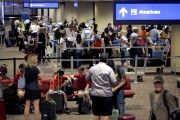 FILE - In this May 27, 2016 file photo, passengers line up to check in before their flight at Sky Harbor International Airport in Phoenix. Significant progress has been made on shortening screening lines since earlier this spring when airlines reported thousands of frustrated passengers were missing flights, the head of the Transportation Security Administration said Tuesday, June 7, 2016. (AP Photo/Matt York, File)