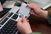 BARKSDALE AFB, La - Senior Airman (SrA) Tabitha Gracie; of the 2d Communications Squadron, Multimedia Center; inserts her Identification Card (ID) into the Common Access Card (CAC) reader so that she can update her current password to meet security measures. ..Photo by Airman First Class Kendra N. Fulton (RELEASED)