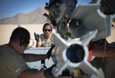 U.S. Air Force Senior Airman Jerilyn Co, armament systems specialist with the New Jersey Air National Guard's 177th Fighter Wing, works with her team to load munitions onto an F-16 Fighting Falcon during Red Flag 16-3, July 20, 2016, on Nellis Air Force Base, Nev. (U.S. Air National Guard photo by Senior Airman Shane Karp/Released)