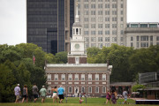 FILE - In this July 30, 2015 file photo, visitors walk in view of Independence Hall in Philadelphia. Democrats are set to begin their convention at the end of July 2016 in a city that symbolizes both the nation's promise and its shortcomings. (AP Photo/Matt Rourke, File)