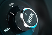 Button with the word risk pointing between medium and high level, 3D render suitable for risk management or decision-making process situation. Depth of field.