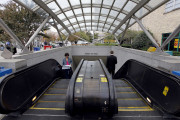 People ride the escalator at the entrance of the Pentagon City Metro station in Arlington, Va., Wednesday, Oct. 27, 2010. Farooque Ahmed, a naturalized citizen born in Pakistan was arrested Wednesday and charged with trying to help people posing as al-Qaida operatives planning to bomb subway stations around the nation's capital, the FBI said. (AP Photo/Alex Brandon)