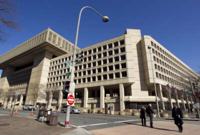 FILE - This Feb. 3, 2012, file photo shows FBI headquarters in Washington. The FBI is warning state officials to boost their election security in light of evidence that hackers breached the election systems of a pair of states. The Aug. 18, 2016, warning came just days after Homeland Security Secretary Jeh Johnson hosted a call with secretaries of state and other state elections officials to talk about cybersecurity and the election infrastructure. (AP Photo/Manuel Balce Ceneta, File)