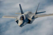 A U.S. Air Force F-35A Lightning II Joint Strike Fighter from the 58th Fighter Squadron, 33rd Fighter Wing, Eglin AFB, Fla., escorts a KC-135R Stratotanker from the 336th Air Refueling Squadron, March ARB, Calif., following an aerial refueling mission, May 16, 2013, off the coast of northwest Florida. The 33rd Fighter Wing is a joint graduate flying and maintenance training wing that trains Air Force, Marine, Navy and international partner operators and maintainers of the F-35 Lightning II. (U.S. Air Force photo by Master Sgt. John R. Nimmo, Sr./RELEASED)