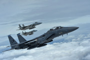 A formation of F-15C Eagles assigned to the 493rd Fighter Squadron, and an F-15E Strike Eagle assigned to the 492nd Fighter Squadron, fly over Gloucestershire, England, to attend the upcoming Royal International Air Tattoo airshow held at RAF Fairford July 7. The RAF Lakenheath aircraft will be on public display, along with many other military aircraft from around the U.K., to provide an opportunity for U.S. and military allies to showcase their capabilities. (U.S. Air Force photo/Senior Airman Erin Trower)