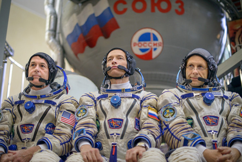 Expedition 49 NASA astronaut Shane Kimbrough, left, Russian cosmonaut Sergei Ryzhikov of Roscosmos, center, and Russian cosmonaut Andrey Borisenko of Roscosmos answer questions from the press outside the Soyuz simulator ahead of their Soyuz qualification exams, Wednesday, Aug. 31, 2016, at the Gagarin Cosmonaut Training Center (GCTC) in Star City, Russia. Photo Credit: (NASA/Bill Ingalls)