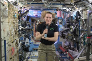 In this image from video made available by NASA, U.S. astronaut Kate Rubins speaks aboard the International Space Station during an interview on Thursday, Sept. 22, 2016. Rubins said that she doesn’t know yet whether she’ll return to Earth in late October as planned. The Russians have delayed the next crew launch for technical reasons. (NASA via AP)