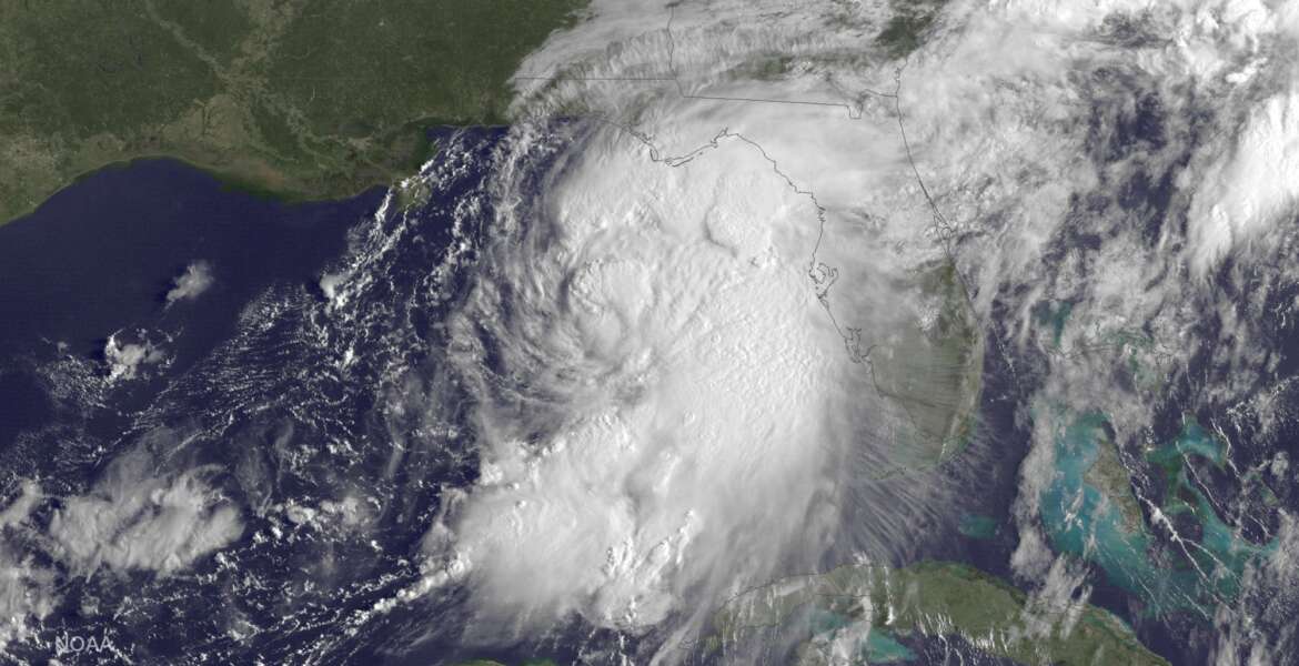 This GOES East satellite image taken at 9:15 a.m EDT, on Thursday, Sept. 1, 2016, and release by NOAA shows Tropical Storm Hermine gathering strength in the Gulf of Mexico. People on Florida's Gulf Coast put up shutters, nailed plywood across storefronts and braced Thursday for Tropical Storm Hermine, which the state's governor called potentially life-threatening as forecasters said it could strike land as a hurricane. (NOAA via AP)