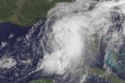 This GOES East satellite image taken at 9:15 a.m EDT, on Thursday, Sept. 1, 2016, and release by NOAA shows Tropical Storm Hermine gathering strength in the Gulf of Mexico. People on Florida's Gulf Coast put up shutters, nailed plywood across storefronts and braced Thursday for Tropical Storm Hermine, which the state's governor called potentially life-threatening as forecasters said it could strike land as a hurricane. (NOAA via AP)