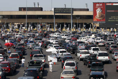 FILE - In this Sept. 22, 2009, file photo, long lines of vehicles wait in line to enter the United States at the San Ysidro Border Crossing in San Diego, Calif. Immigration authorities caught barely half of the people who illegally entered the U.S. from Mexico last year, according to an internal Department of Homeland Security report that offers one of the most detailed assessments of border security ever compiled. Homeland Security officials had no immediately comment Thursday, Oct. 6, 2016. (AP Photo/Lenny Ignelzi, File)