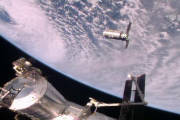 This photo provided by NASA TV shows the Cygnus resupply ship, above, slowly approaching the International Space Station before the Canadarm2 reaches out and grapples it, Sunday, Oct. 23, 2016. Once the Cygnus is unloaded, it will be filled with trash and set loose to burn up in the atmosphere in mid-November. (NASA TV via AP)