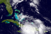 The GOES East satellite image provided by the National Oceanic and Atmospheric Administration (NOAA) and taken Tuesday, Oct. 4, 2016 at 1:12 p.m. EDT, shows Hurricane Matthew over the Caribbean region.  Hurricane Matthew roared across the southwestern tip of Haiti with 145 mph winds Tuesday, Oct. 4, 2016, uprooting trees and tearing roofs from homes in a largely rural corner of the impoverished country as the storm headed north toward Cuba and the east coast of Florida. (NOAA via AP)