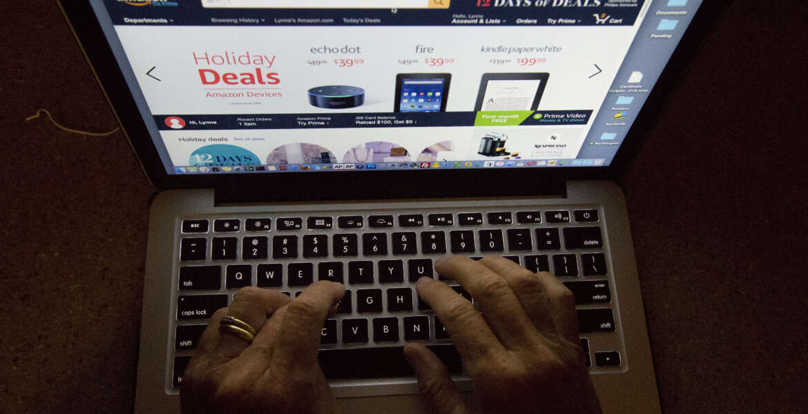 In this Monday, Dec. 12, 2016, photo, an online shopper searches a site, while logged in from Miami. Procrastinating holiday shoppers are finding a haven online with expedited shipping and same-day delivery services. (AP Photo/Wilfredo Lee)