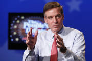 CORRECTS TO ED GILLESPIE-US Sen. Mark Warner, D-Va.,  looks over the set prior to a debate in Richmond, Va., Monday, Oct. 13, 2014.  Warner faces Republican challenger Ed Gillespie face each other in the November 4th election.  (AP Photo/Steve Helber)